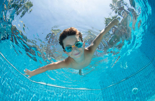 Child swimming in a residential pool